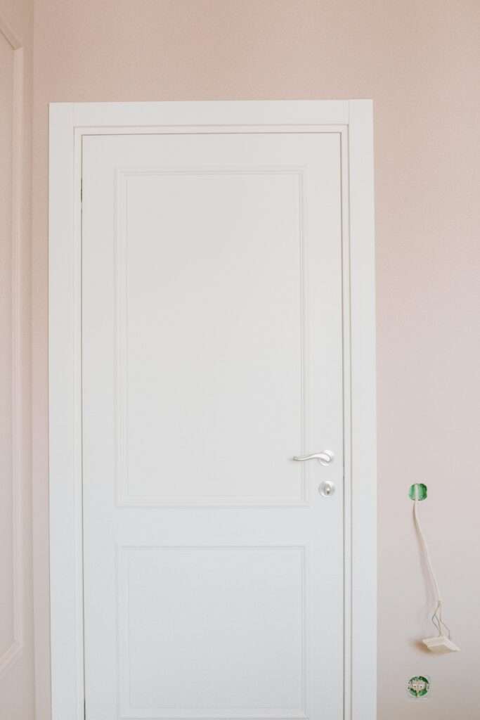 White wooden interior door in a modern apartment